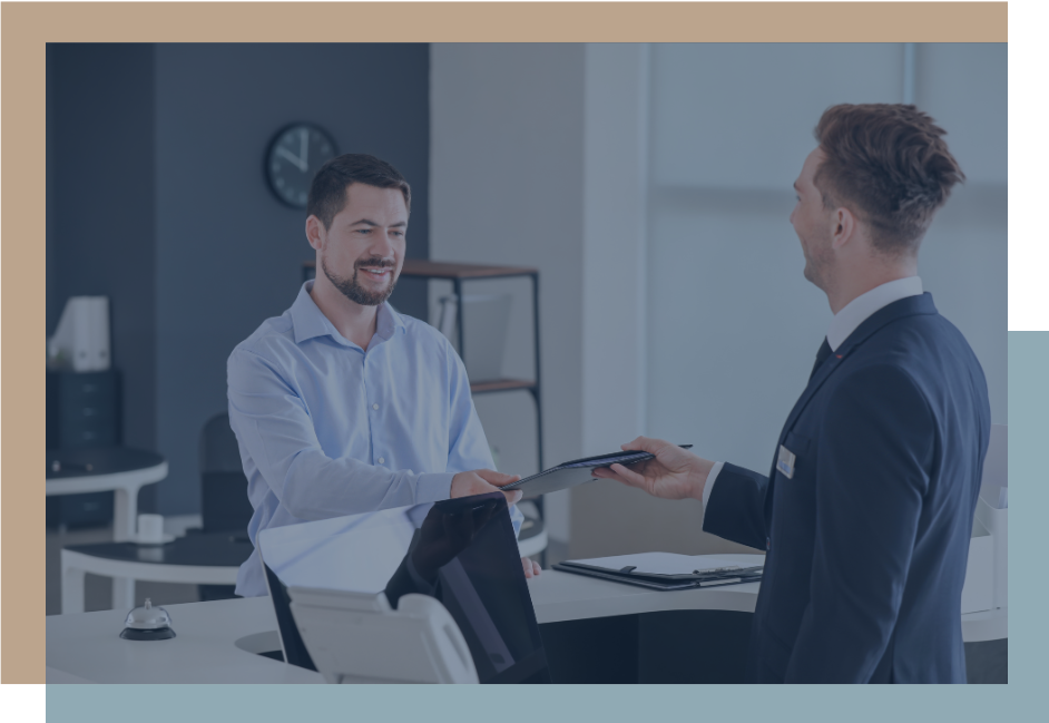 2 men handing off documents in a folder